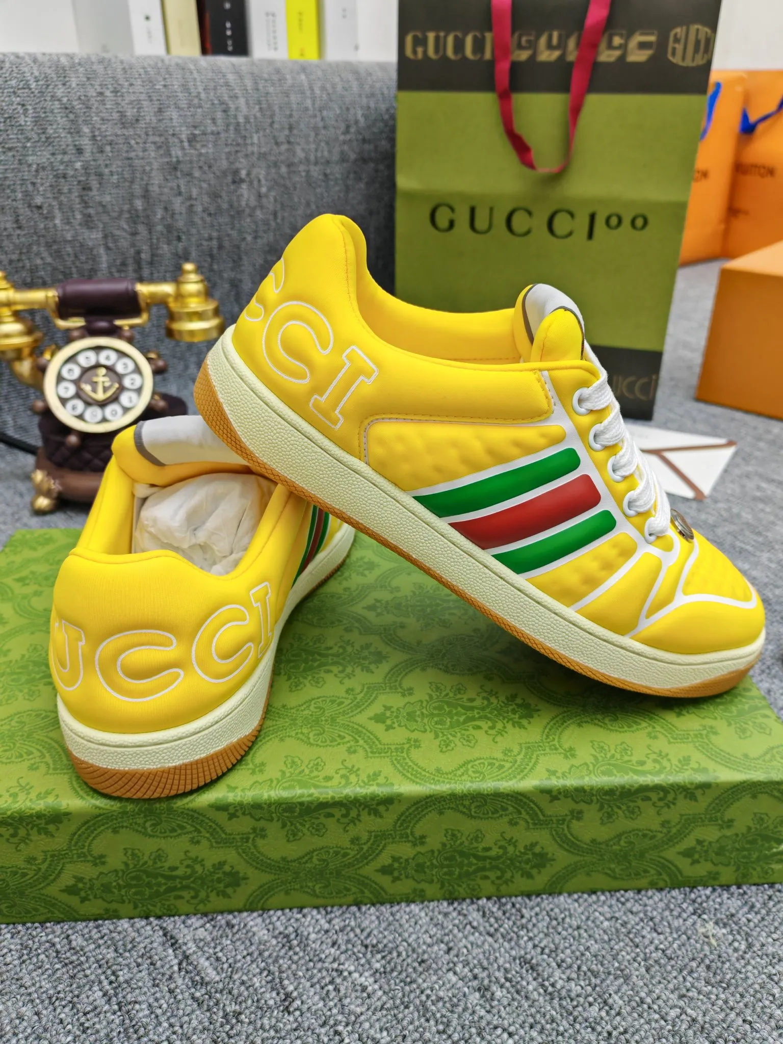 Factory price 600💰Screener series embellished web sneakers. This item is from the Gucci Lido series. Its design is inspired by the summer style and beach clubs of the Italian coast. The Screener series of sneakers draws inspiration from classic sneakers from the 1970s and takes its name from a special defensive move in sports. This shoe from the 2024 Pre-Fall collection is crafted from yellow rubber, a technical and malleable opaque material, with striped webbing on the sides and an embossed Gucci printed logo on the heel. Yellow rubber, opaque and technological in appearance. Red and green webbing decorated with metal Double G oval enamel details. Gucci printed embossed logo. Women 35-40, men 38-45, (men 38 and 45 need to be customized)